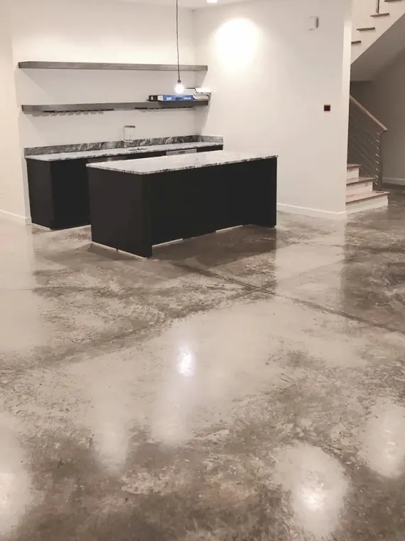 Pale gray marbled metallic floor under a kitchen island